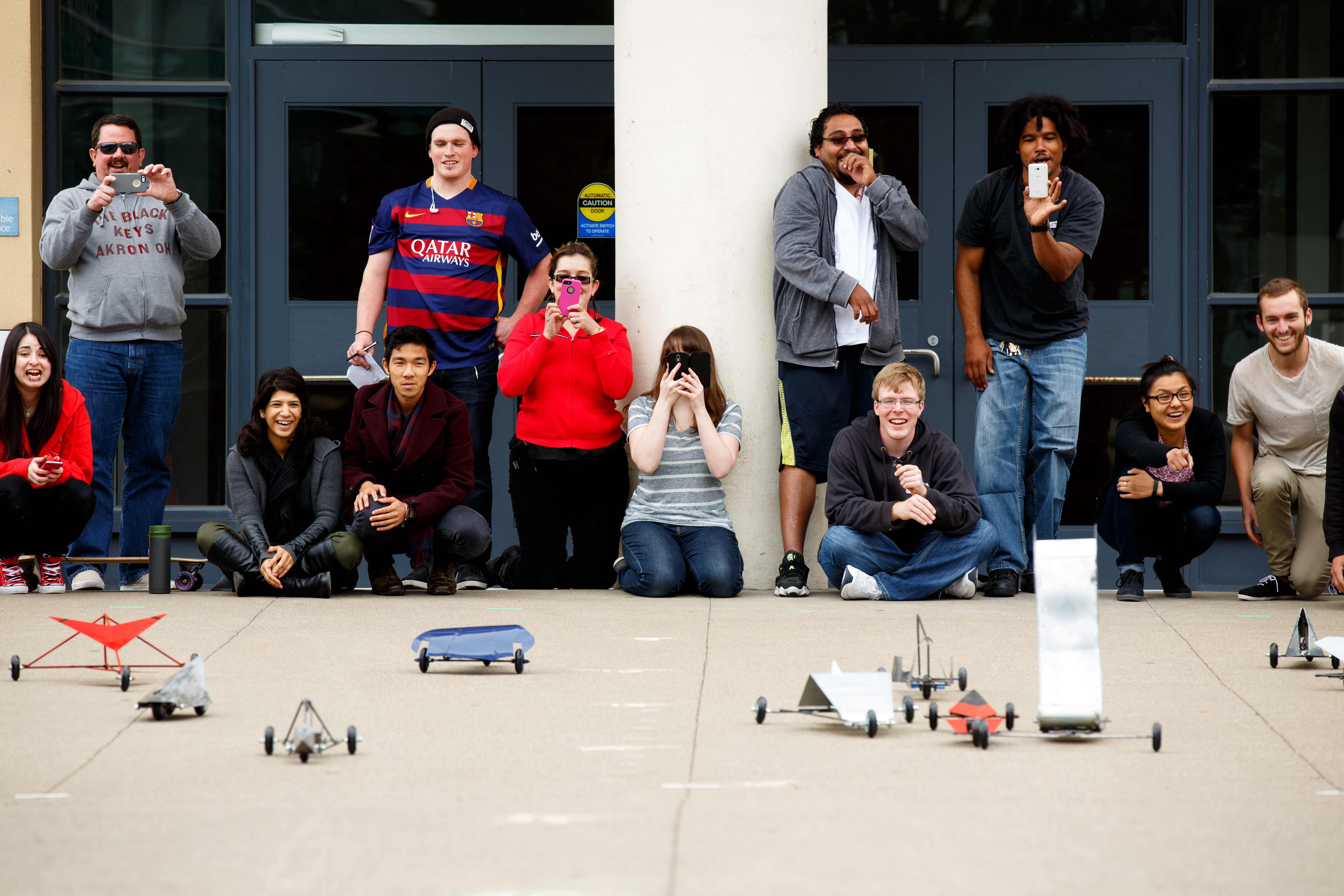 engineering students outside racing their car creations